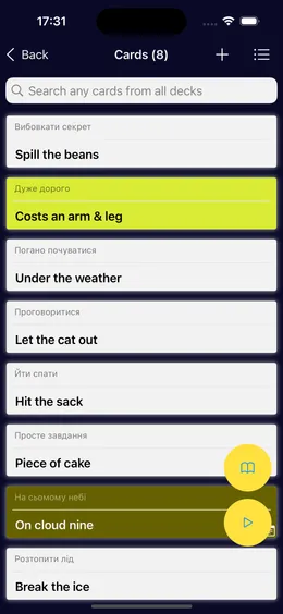Cards in a deck: English idioms such as Spill the beans and Costs an arm and a leg, each with a translation above it.