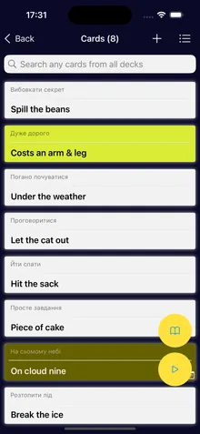 Cards in a deck: English idioms such as Spill the beans and Costs an arm and a leg, each with a translation above it.